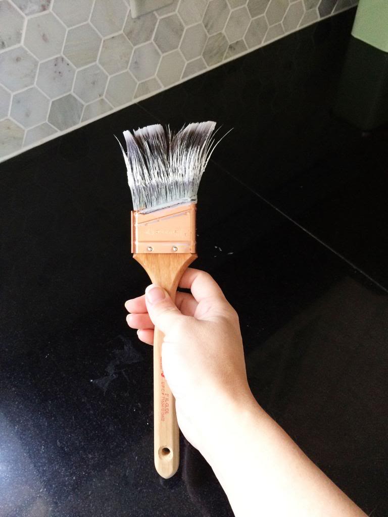 cleaning a paintbrush